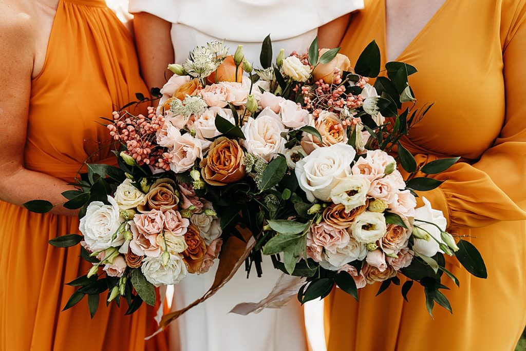 fall wedding flowers and orange bridesmaids dresses 