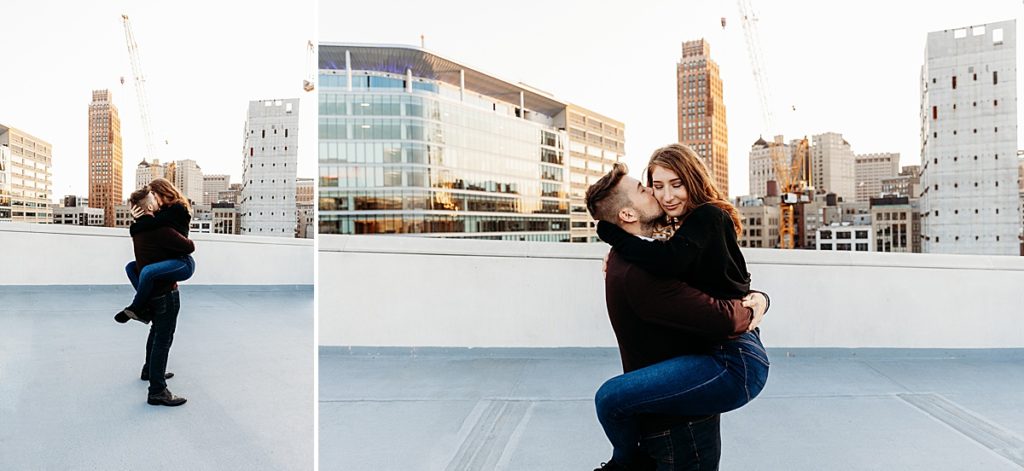 couple being playful on top of parking garage