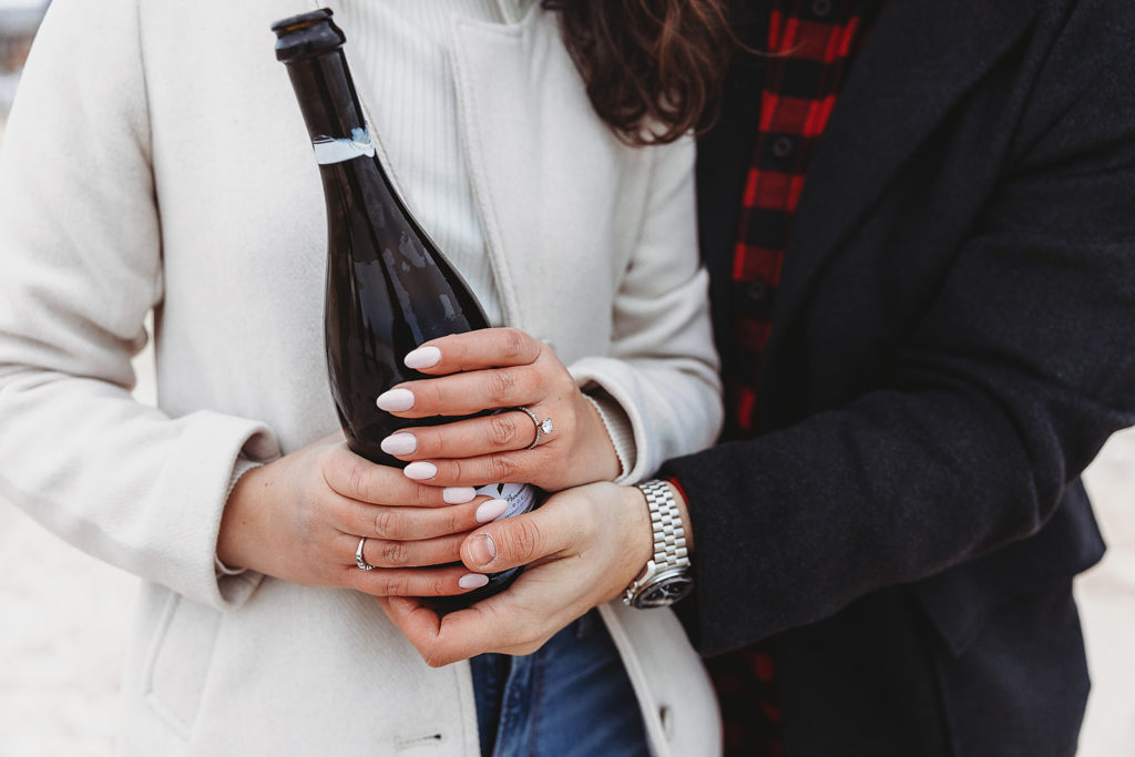 couple holding champagne at winter couples photos