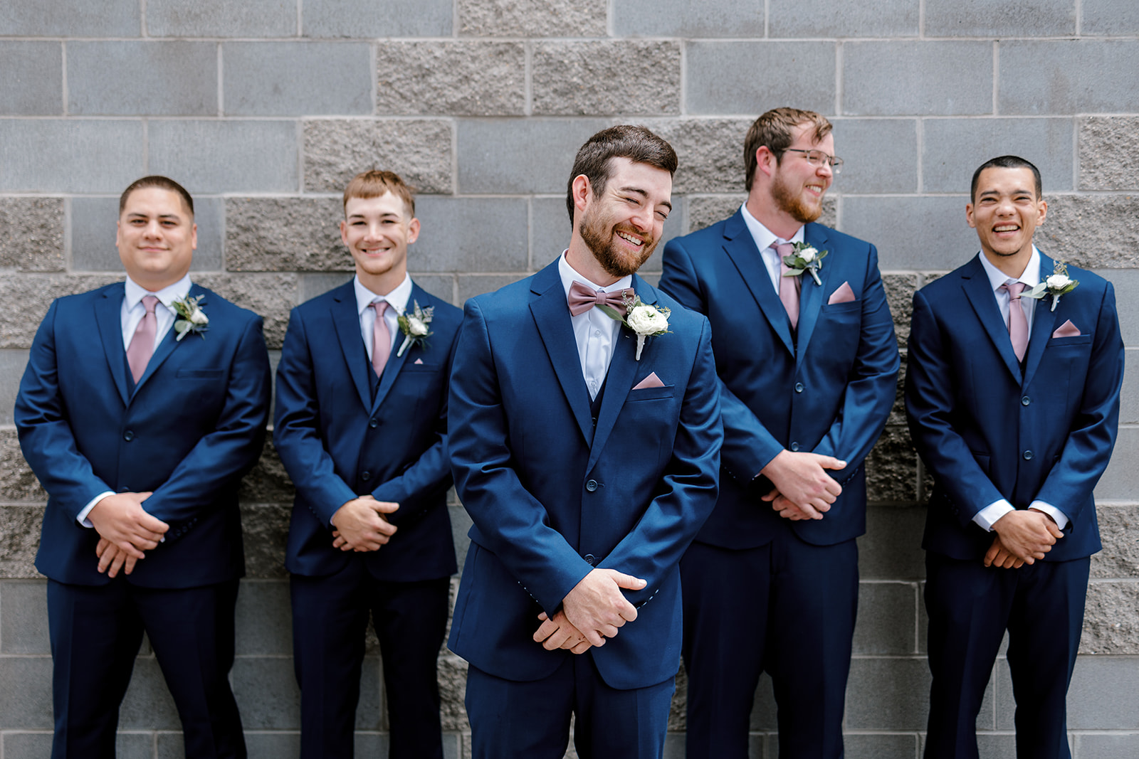 groomsmen posing for pictures