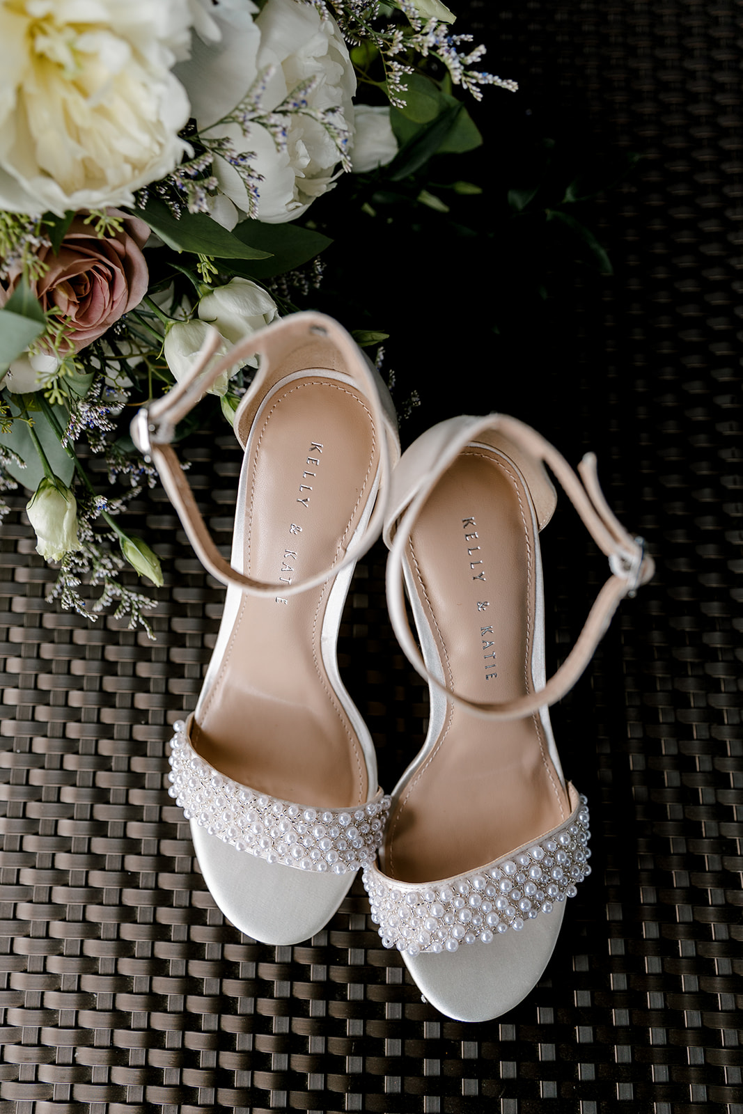 bride shoes with wedding bouquet with Michigan wedding photographer Port 393 Wedding In Holland, Michigan | Allie + Ryan