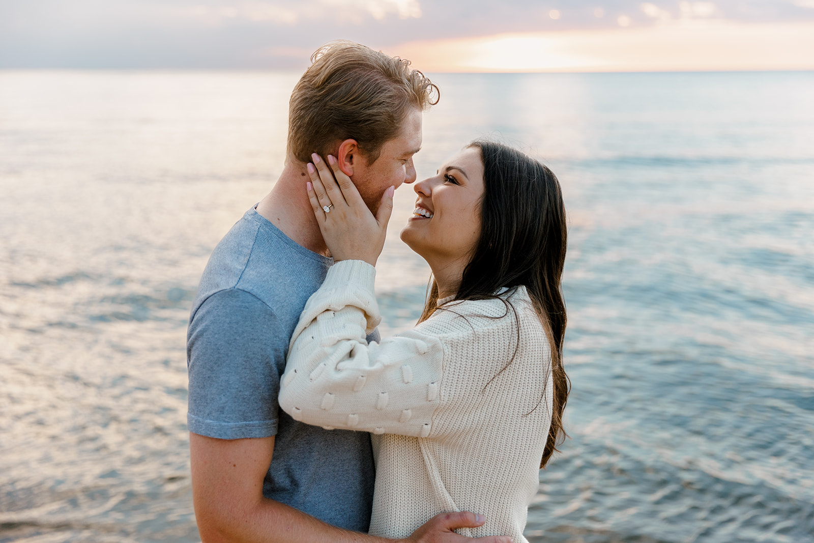 Couple during engagement session at Oval Beach in Michigan