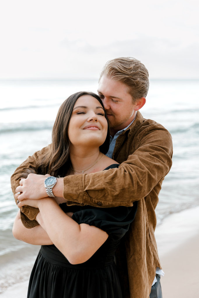 Romantic engagement session at Oval Beach in Michigan