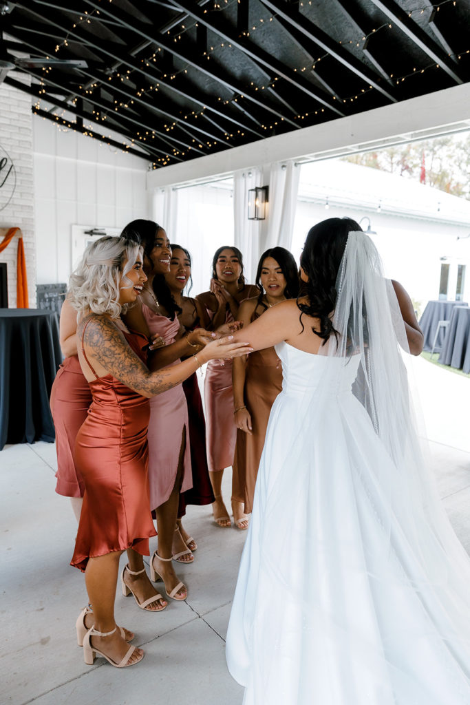 bride and bridesmaids during first looks