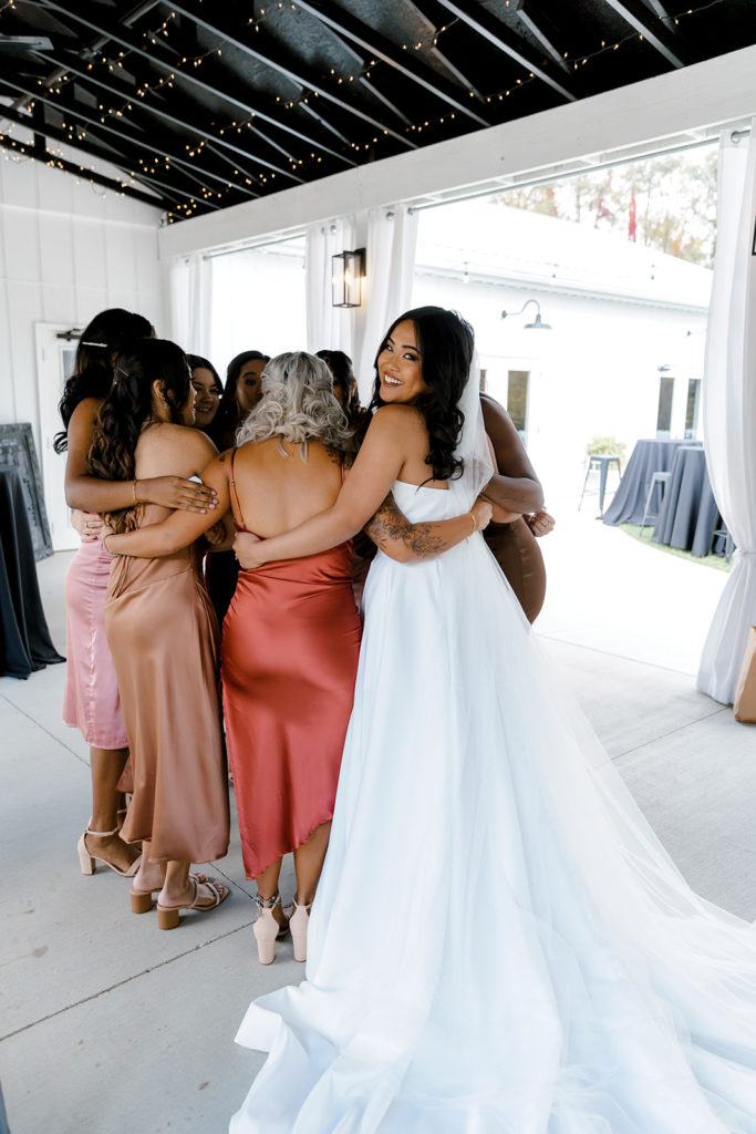 bride and bridesmaids during first look