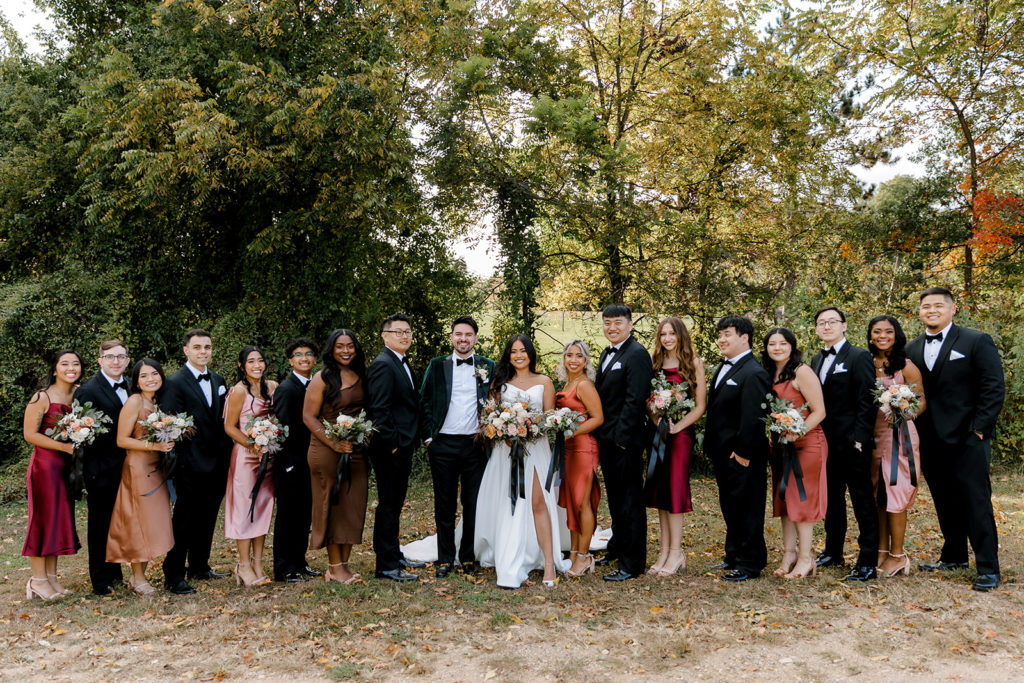 entire bridal party posing for wedding photos