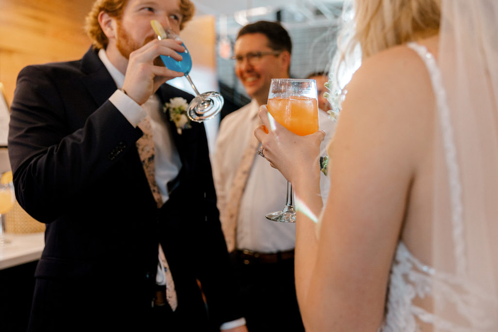 Bride and groom drinking after ceremony