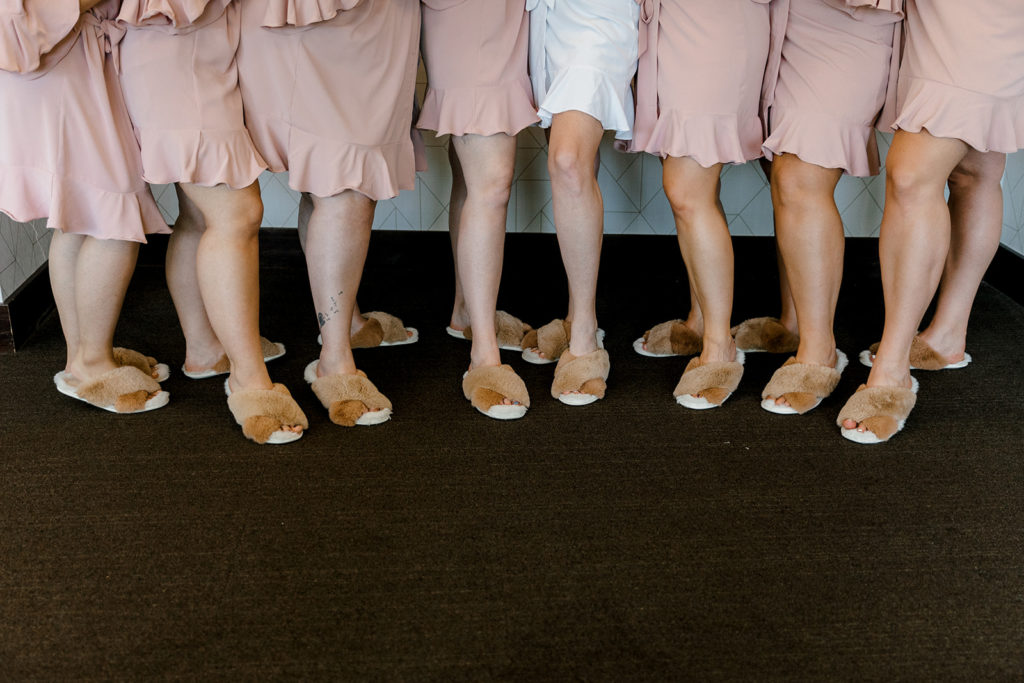 Bride and bridesmaids wearing slippers