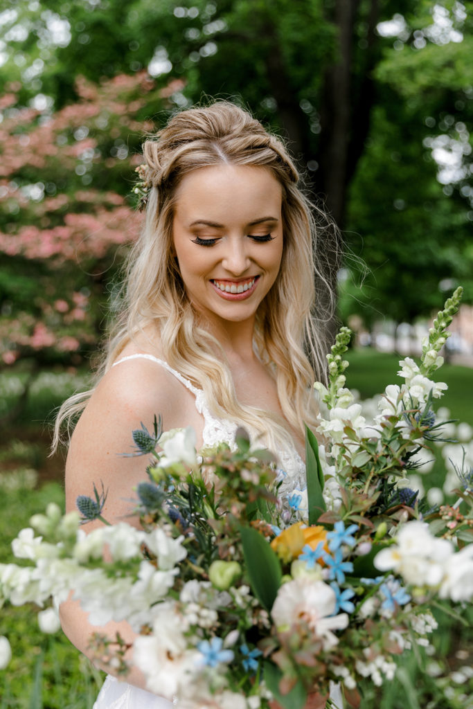 Bride holding wildflower wedding bouquet