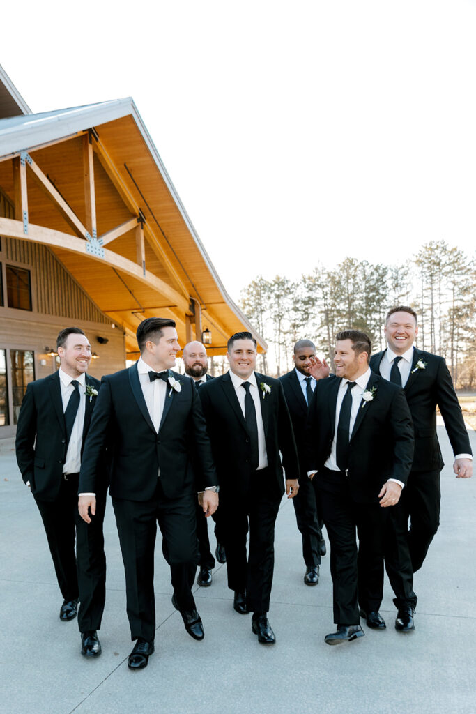 Groom and groomsman portraits at The Black River Barn South Haven wedding venue