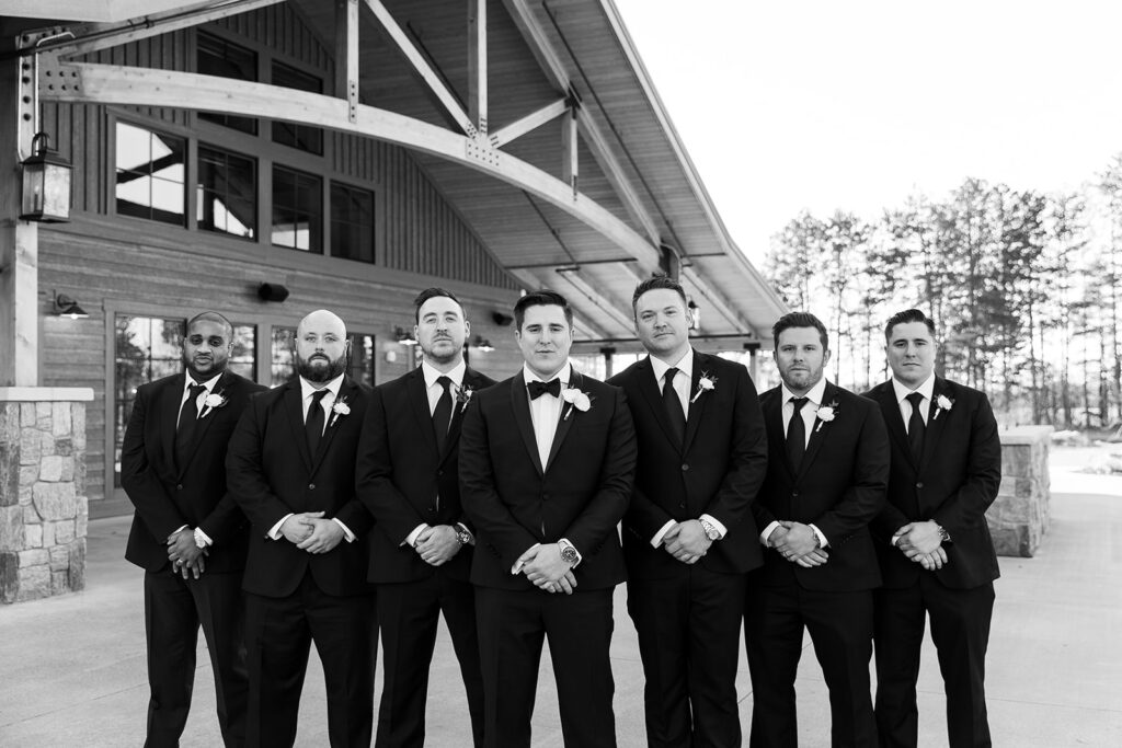 Groom and groomsman portraits at The Black River Barn South Haven wedding venue