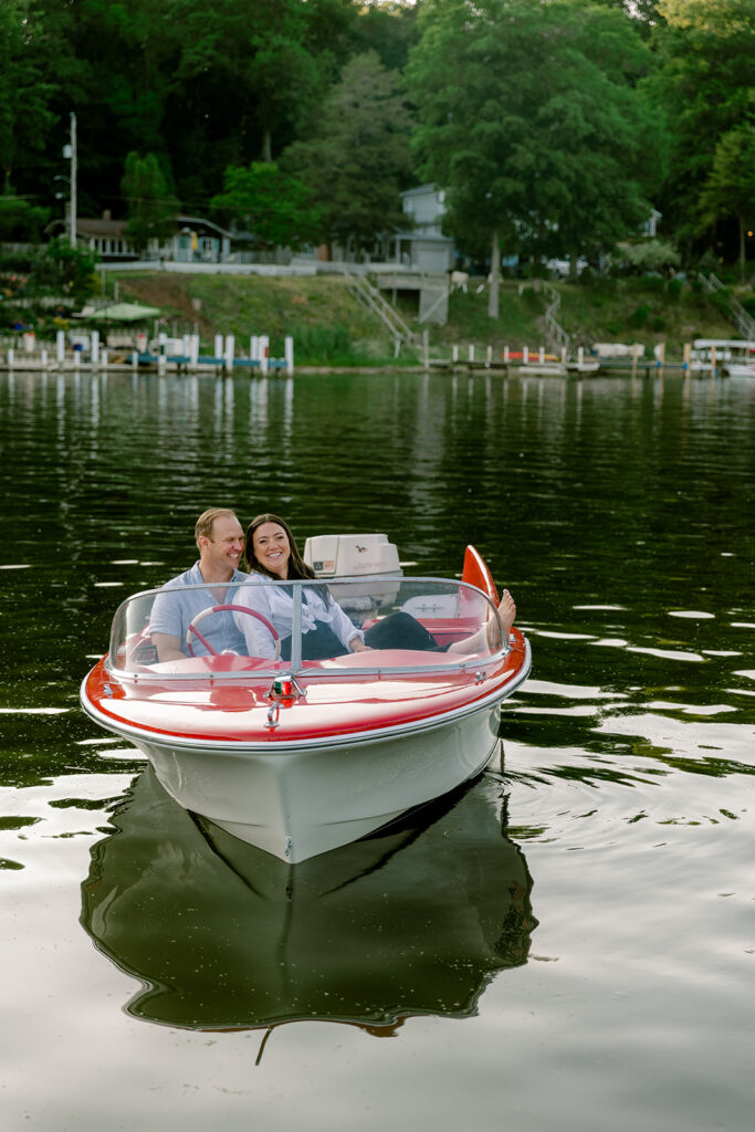 Couple posing for photos on a boat
