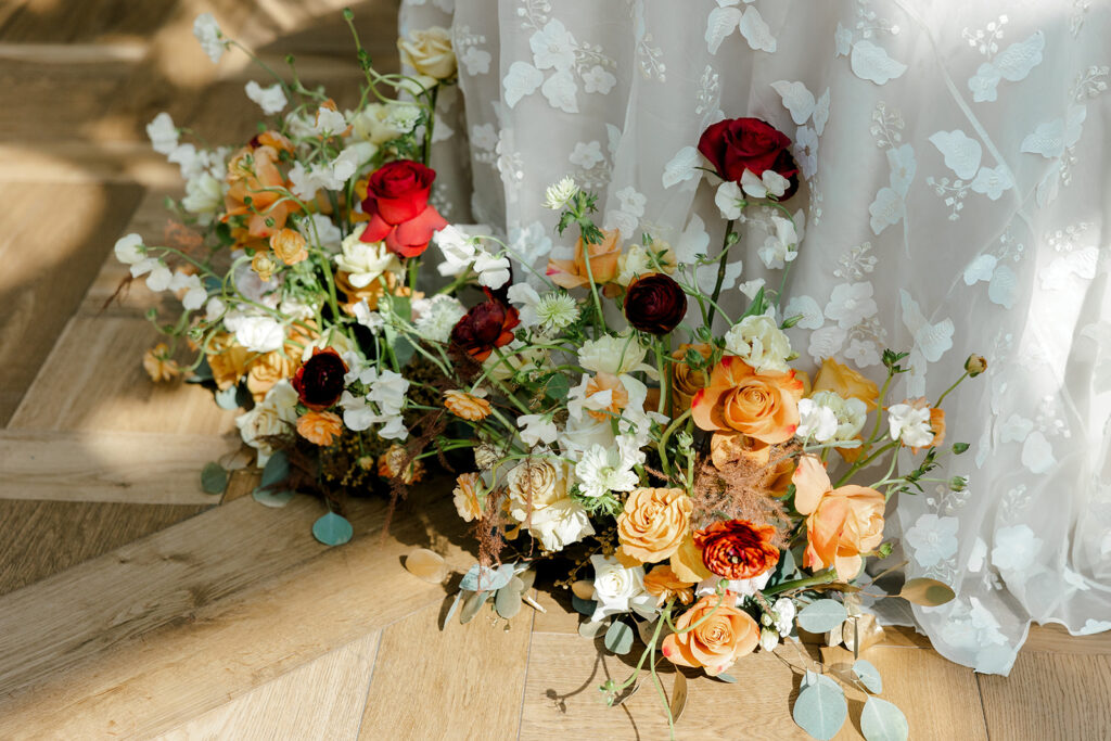 Vibrant, sophisticated florals frame tables at mocha-themed wedding