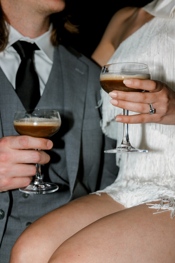 Bride and groom enjoy an espresso martini at their wedding reception at Anthology Events in Book Tower in downtown Detroit