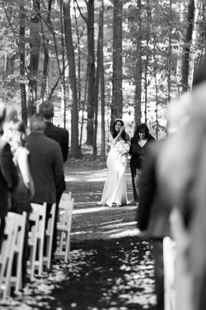Bride makes her way down the aisle in step with her mother