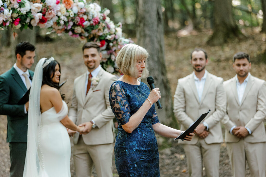 Wedding guest reads at Michigan wedding ceremony
