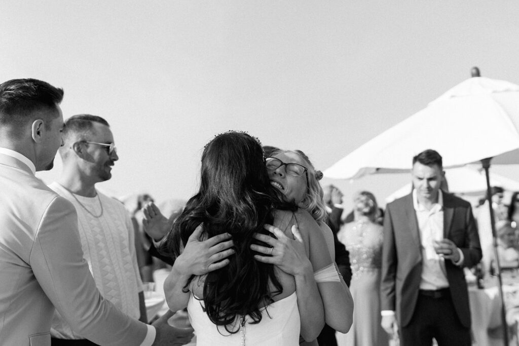 Editorial style candids of bride and groom greeting guests at cocktail hour