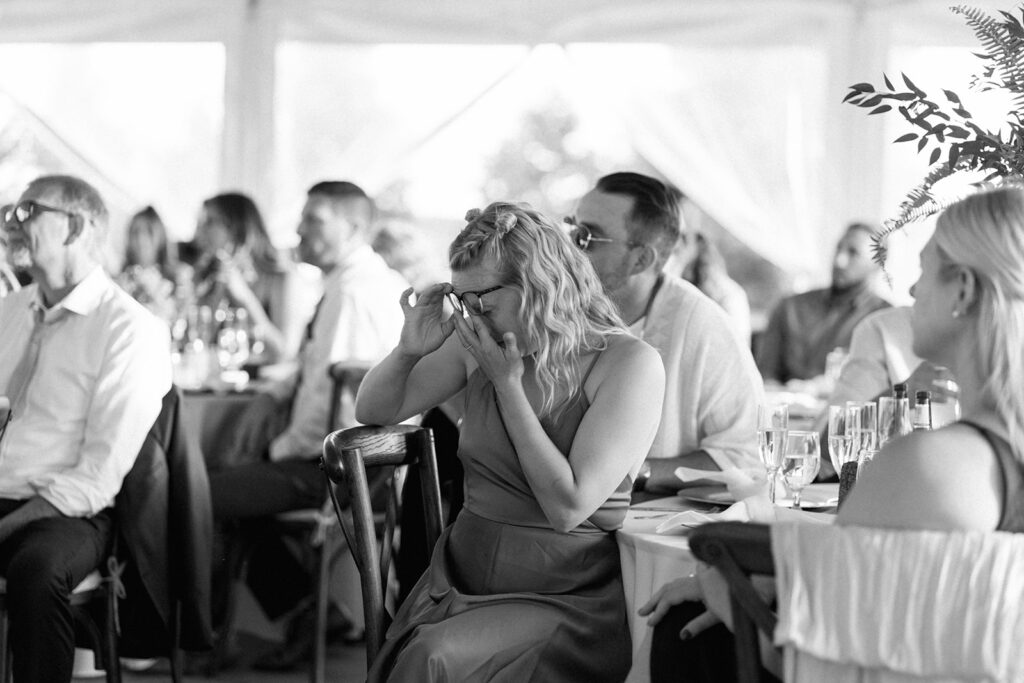 Wedding guest wipes her eyes during emotional speech at Michigan wedding