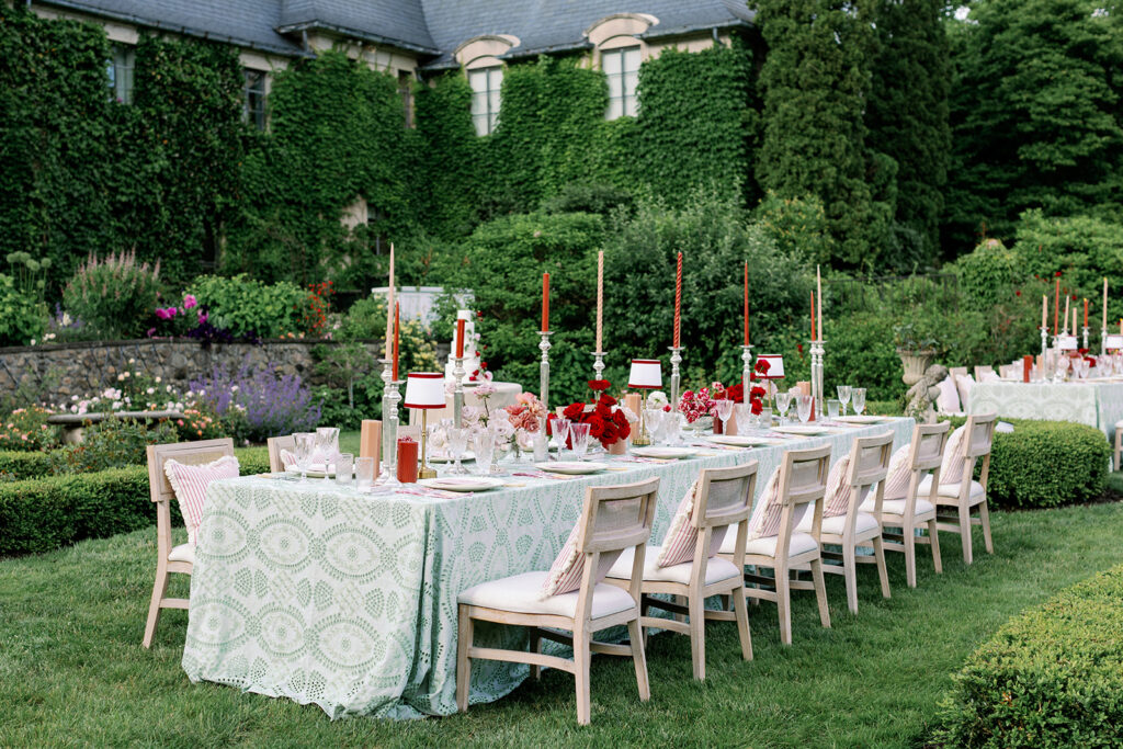 Elegant outdoor tablescape surrounded by lush greenery at European style wedding venue