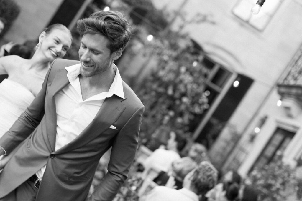 Bride and groom grin as they make their way down the aisle of their courtyard ceremony at Greencrest Manor