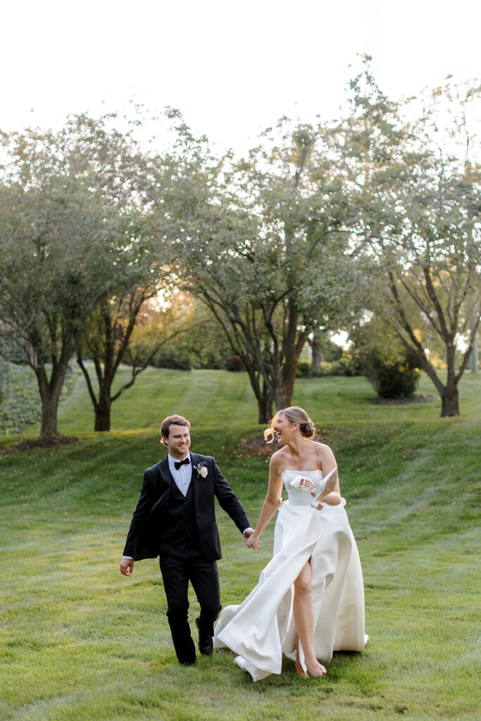 Couple walking hand-in-hand during golden hour, a relaxed portrait perfect for any wedding photography shot list.
