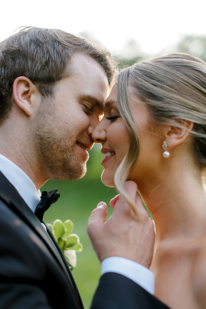 Bride and groom nose to nose, smiling during their first look—one of the most emotional wedding photo opportunities.
