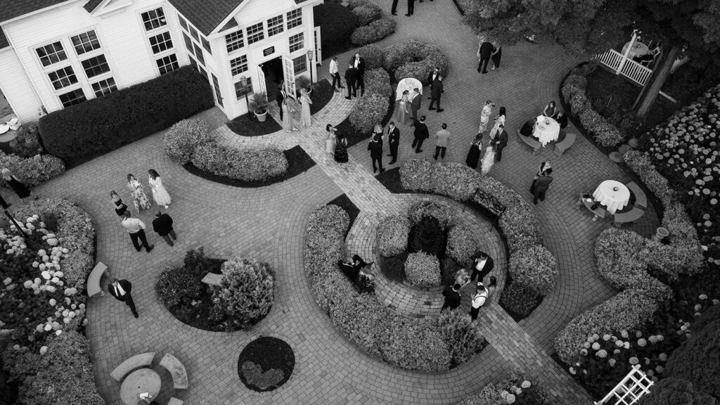 Black and white aerial view of garden ceremony venue, a creative wedding photo showcasing setting and atmosphere.